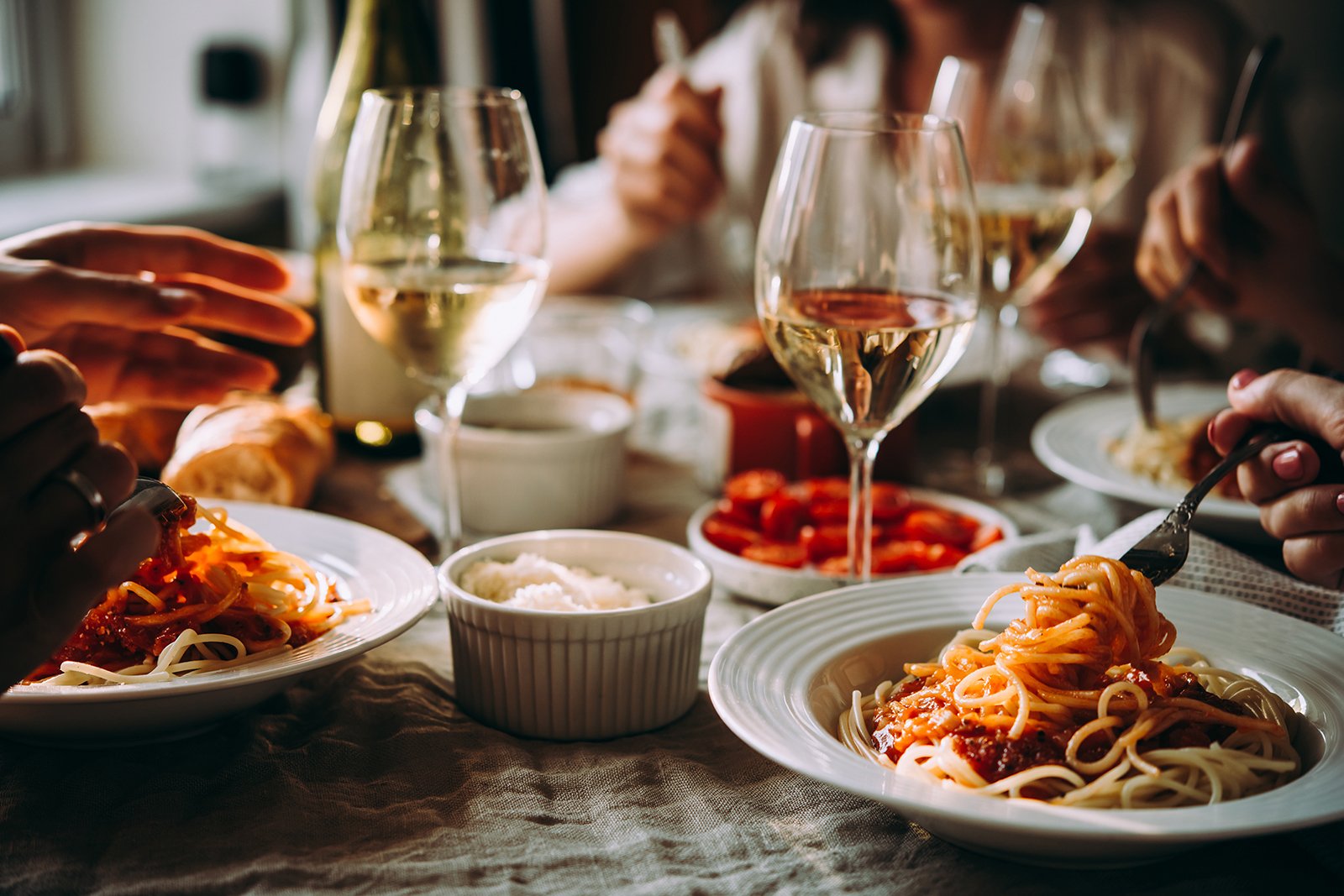 Italian-Table-Setting-with-people-eating-scrumptous-pasta-